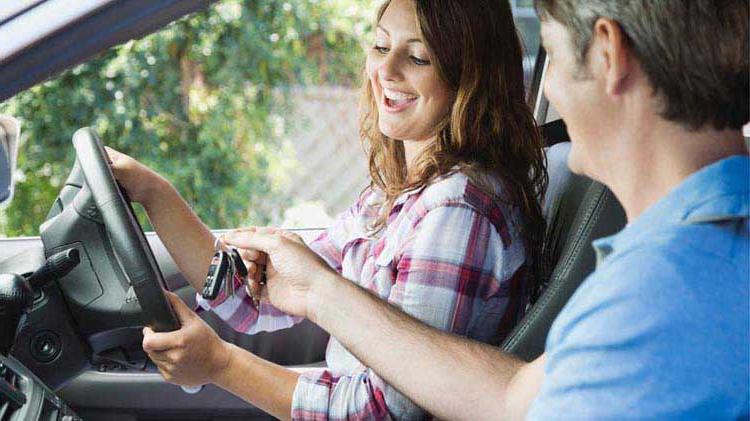 Teen driver learning about seat belt safety